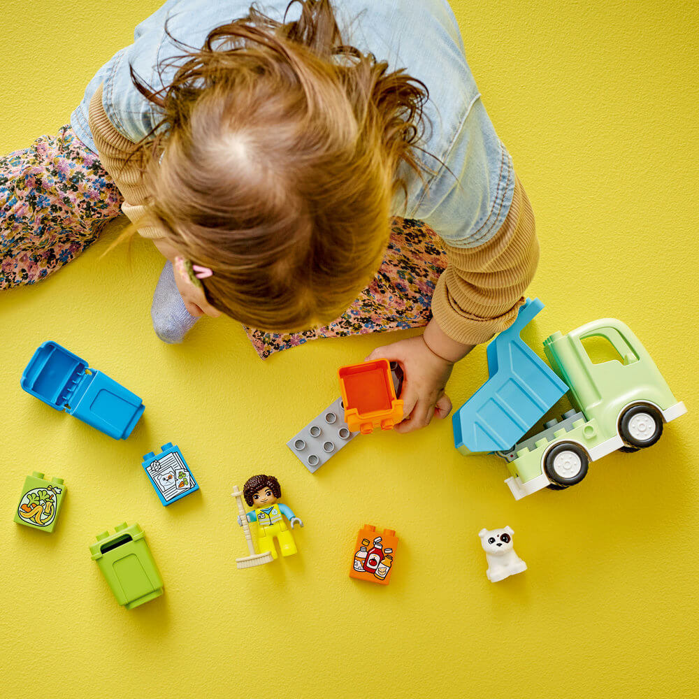 Child playing with LEGO® DUPLO® Town Recycling Truck 10987 Building Toy Set (15 Pieces)