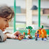 Child playing with the LEGO® Minecraft® The Pumpkin Farm 21248 Building Toy Set (257 Pieces)