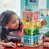 Girl playing with the LEGO® Friends Heartlake City Community Center 41748 Building Toy Set (1,513 Pieces)