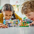 Two kids playing with the LEGO® Friends Newsroom Van 41749 Building Toy Set (446 Pieces)