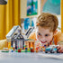 Child shown playing with the completed LEGO® City Family House and Electric Car 60398 Building Toy Set (462 Pieces)