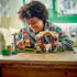 Child smiling as they play with the LEGO® Super Mario™ Donkey Kong’s Tree House Expansion Set 71424 Building Toy Set (555 Pieces)