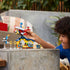 Child shown playing with the LEGO® Sonic the Hedgehog™ Tails’ Workshop and Tornado Plane 76991 (376 Pieces)