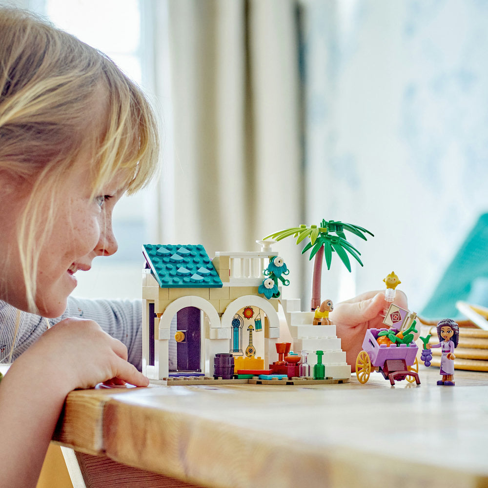 Close up image of a girl playing Lego Disney Princess Wish Ashain 