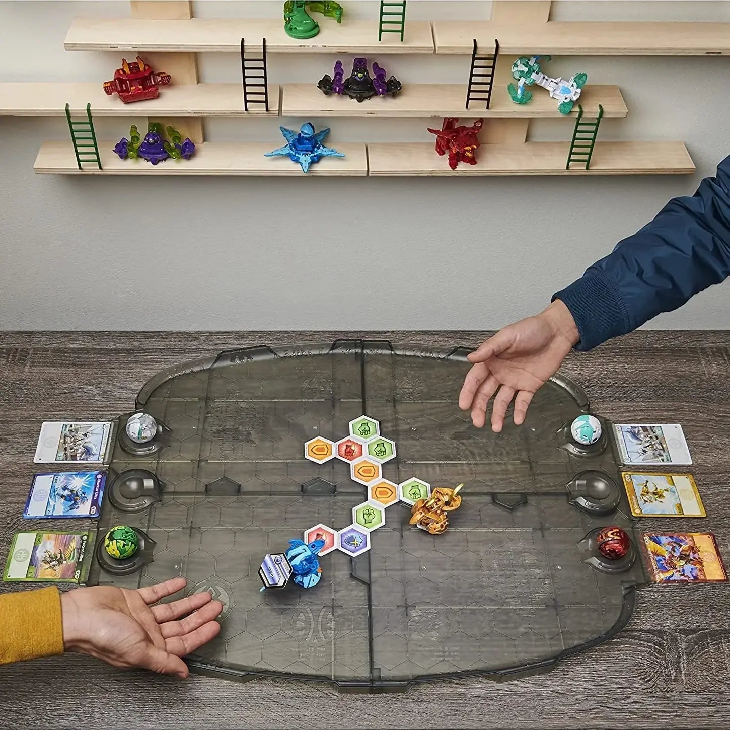 Two people playing the Bakugan Geogan Rising Battle Matrix Game