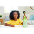 Girl playing with Disney Princess Princess Tiana Fashion Doll