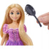 Doll from waist up shown with fryinging pan that is included with the Disney Princess Rapunzel & Maximus Play Set