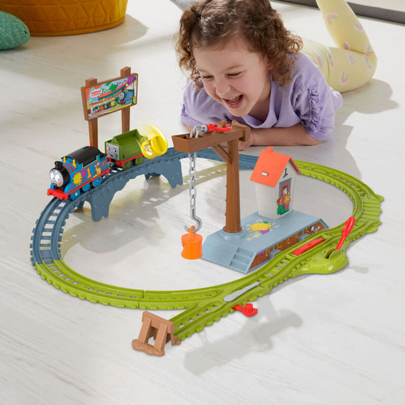 Girl playing with the Fisher-Price Thomas & Friends Paint Delivery Set