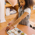 Girl playing with the Melissa and Doug Slice and Bake Cookie Wooden Food Play Set