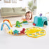 child playing with Hape Railway Dinosaur Train Bucket Set