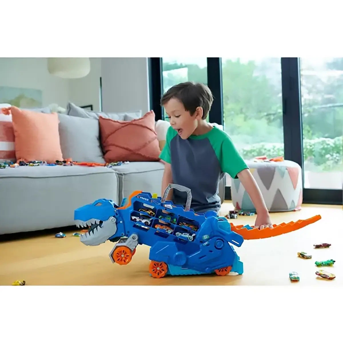 Hot Wheels City Ultimate T-Rex Transporter with boy playing