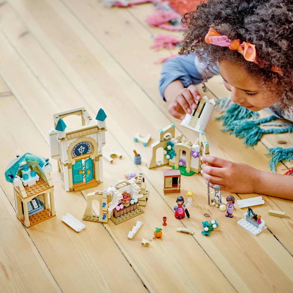 Image of a girl playing the LEGO® Disney Princess Wish King Magnifico's Castle 613 Piece Building Set