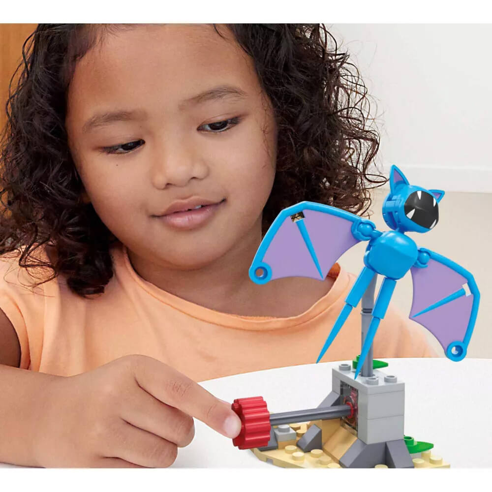 Child playing with MEGA Pokémon Zubat's Midnight Flight 61 Piece Building Set