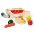 Melissa and Doug Cutting Food Wooden Food Play Set with some pieces removed and the bread being cut by knife