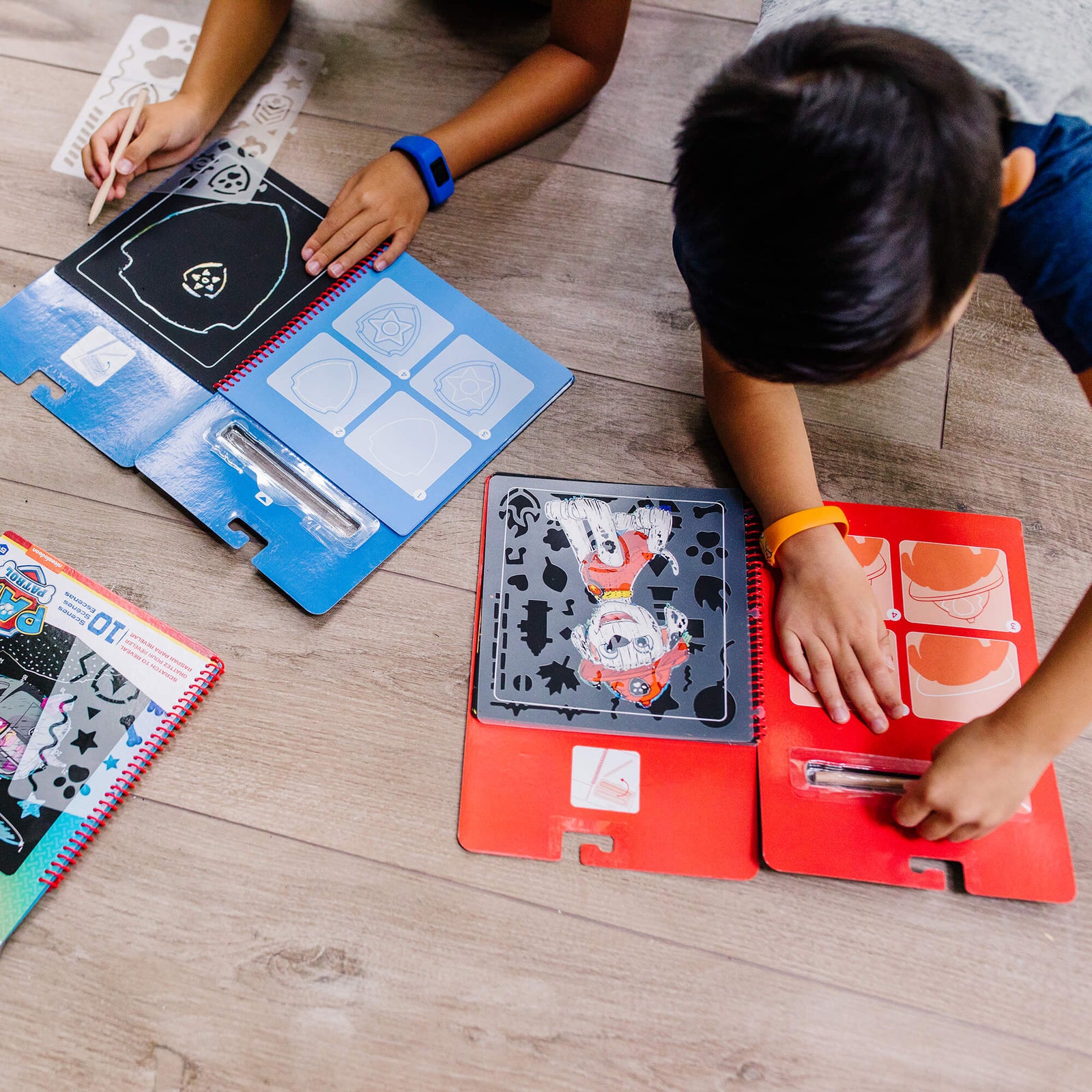 Kids using the Melissa and Doug PAW Patrol Marshall Scratch Art Pad