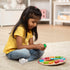 Little Girl playing with Melissa and Doug Shape Sorting Clock