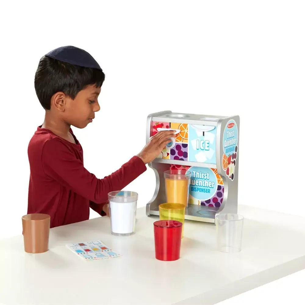 Boy wearing red long sleeve operating the drink dispenser playset