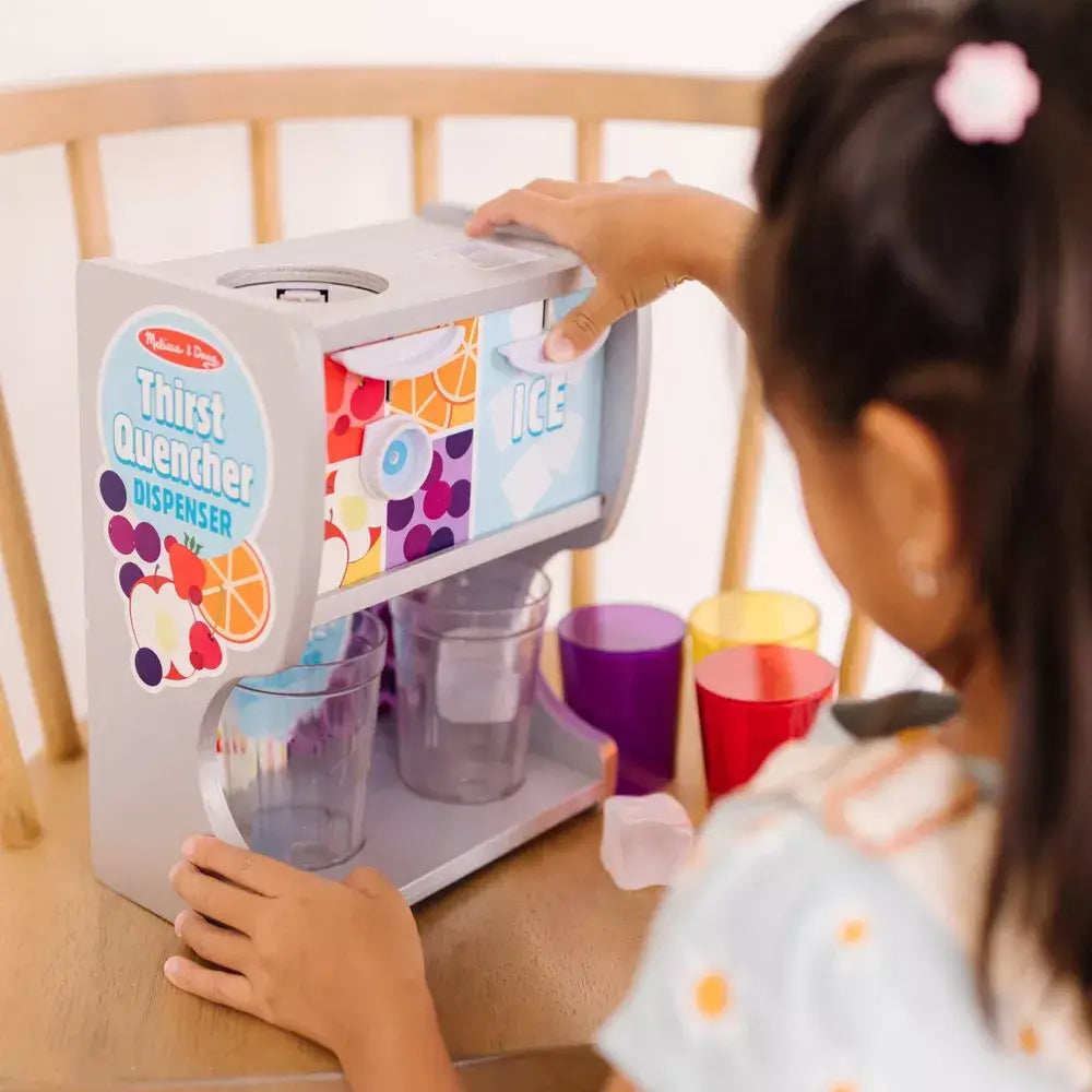 Girl pressing a button on the Melissa and Doug Thirst Quencher Drink Dispenser