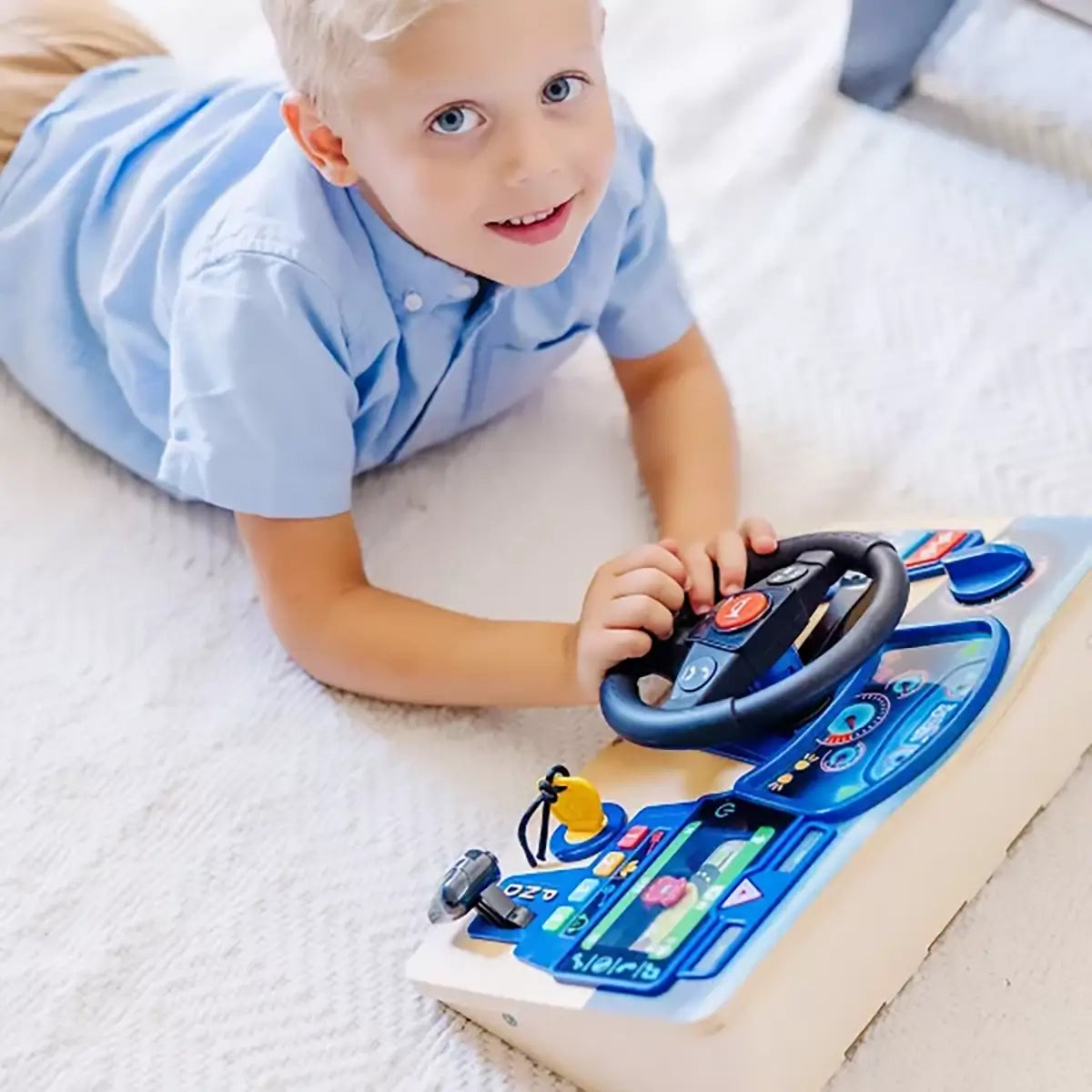 Boy playing with Melissa and Doug Vroom & Zoom Interactive Dashboard