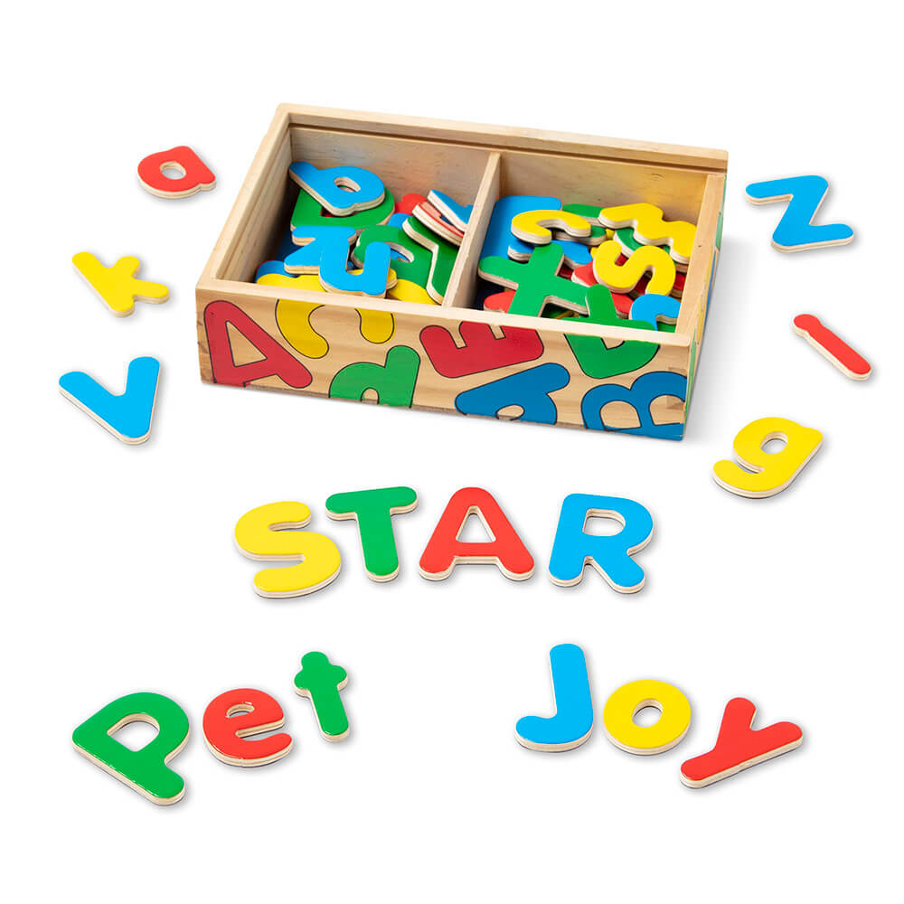 The words star, pet, and joy spelled out with the Melissa and Doug Wooden Letter Alphabet Magnets.  Also showing the box to store them in with leftover letters