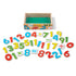 Open package of the Melissa and Doug Wooden Numbers Magnets displaying all the numbers and packaging