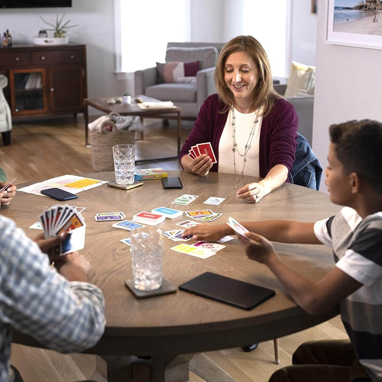 Family playing the Monopoly Bid Card Game