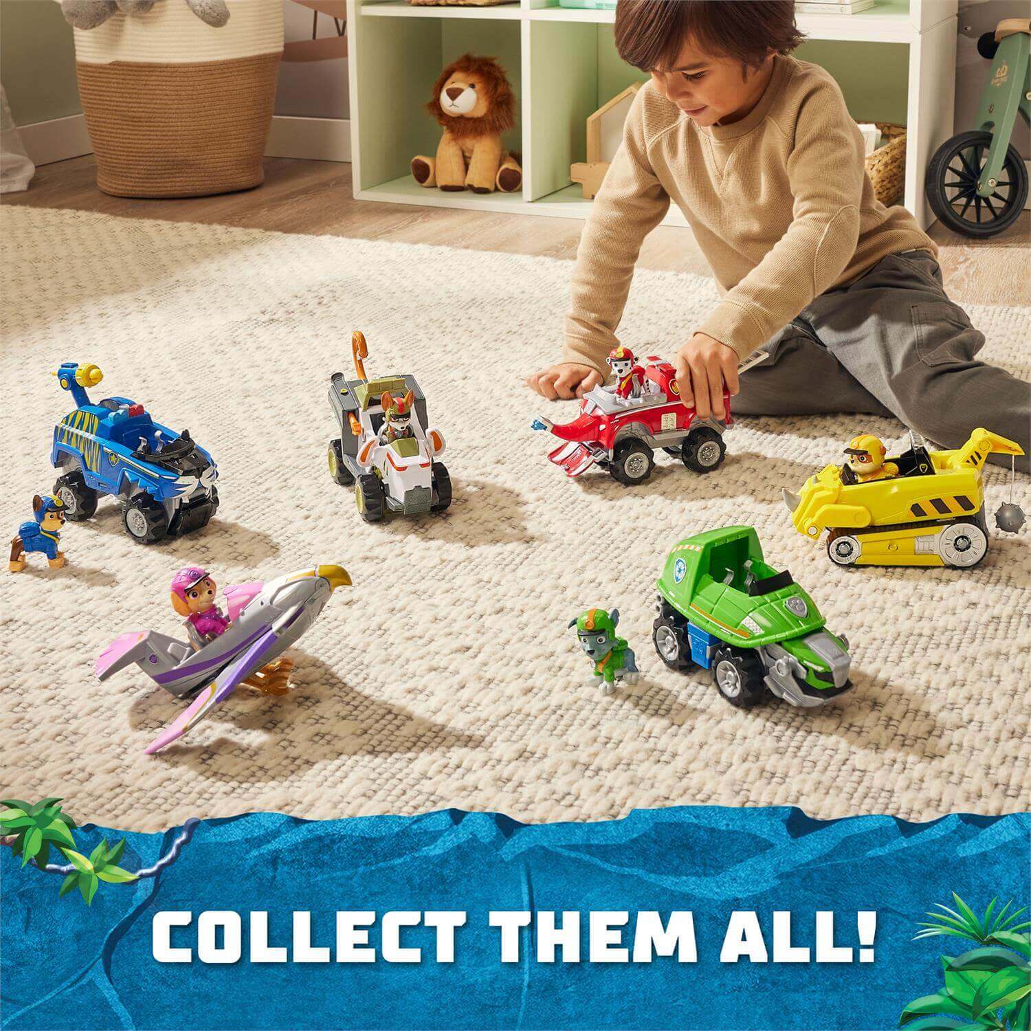 Child playing with the PAW Patrol Jungle Pups Rubble's Rhino Vehicle and other toys (not included)