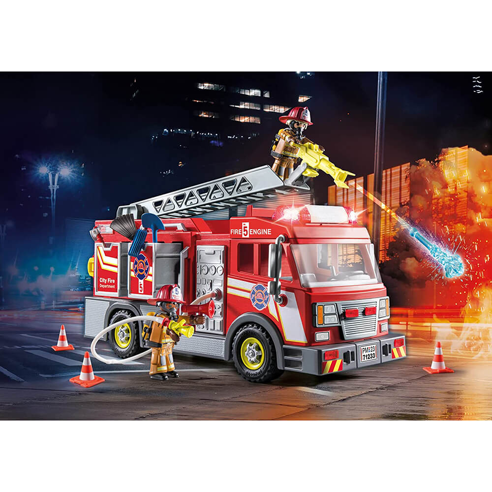 PLAYMOBIL City Action US Fire Truck with Lights (71233) pieces set up with truck with a background putting out a fake fire