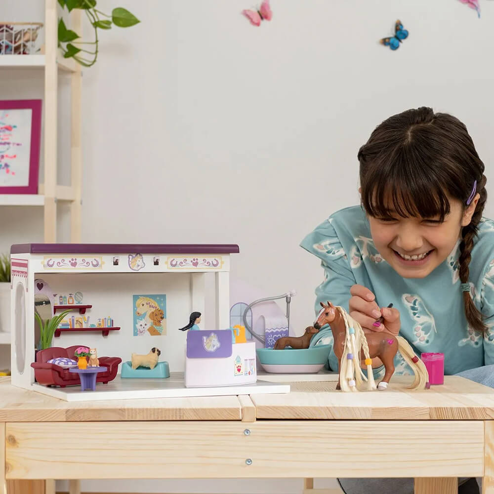 Girl playing with the Schleich Horse Club Sofia's Beauties Pet Salon Set