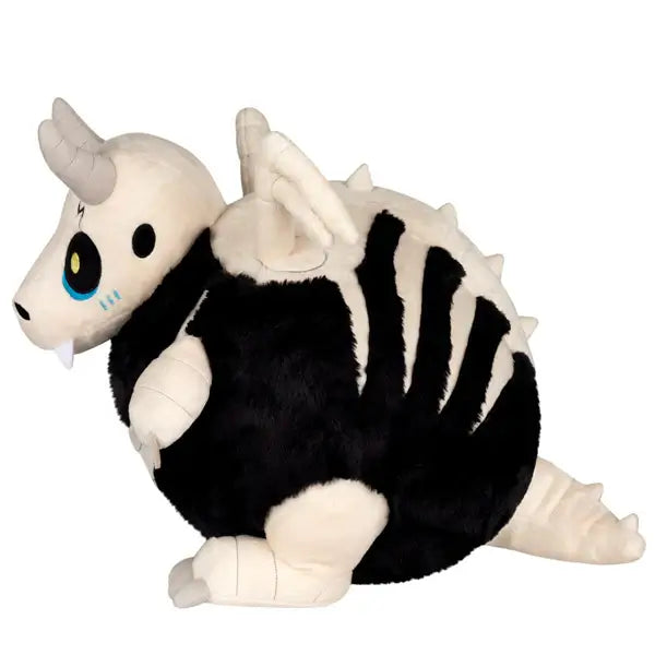 Side view of the Squishable Bone Dragon Plush in black and off-white