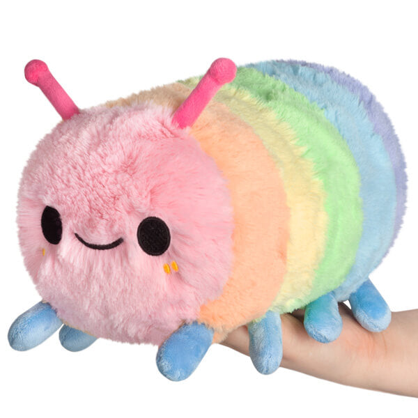 Squishable Mini Rainbow Caterpillar Plush being held in someone's hand.