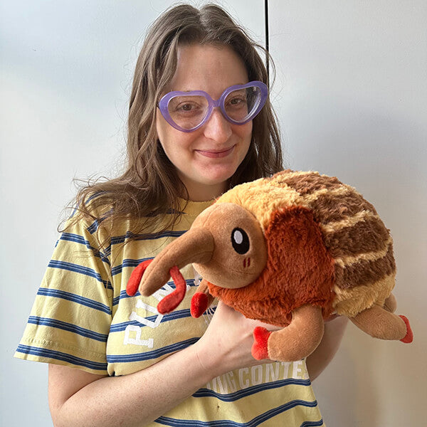 Woman holding the Squishable Mini Weevil Plush