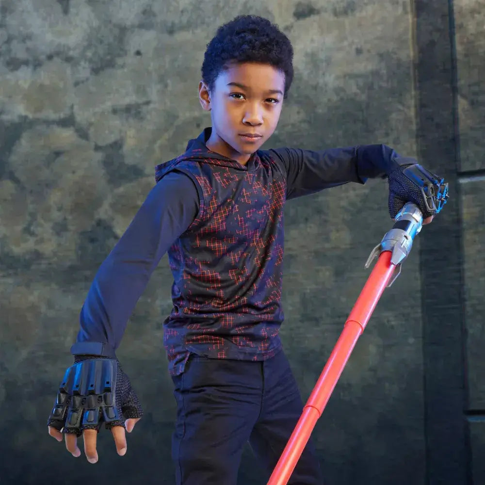 Boy posing with the Star Wars Lightsaber Forge Darth Maul Extendable Red Lightsaber