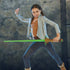 Girl posing in a fight stance with the Star Wars Lightsaber Forge Yoda Extendable Green Lightsaber