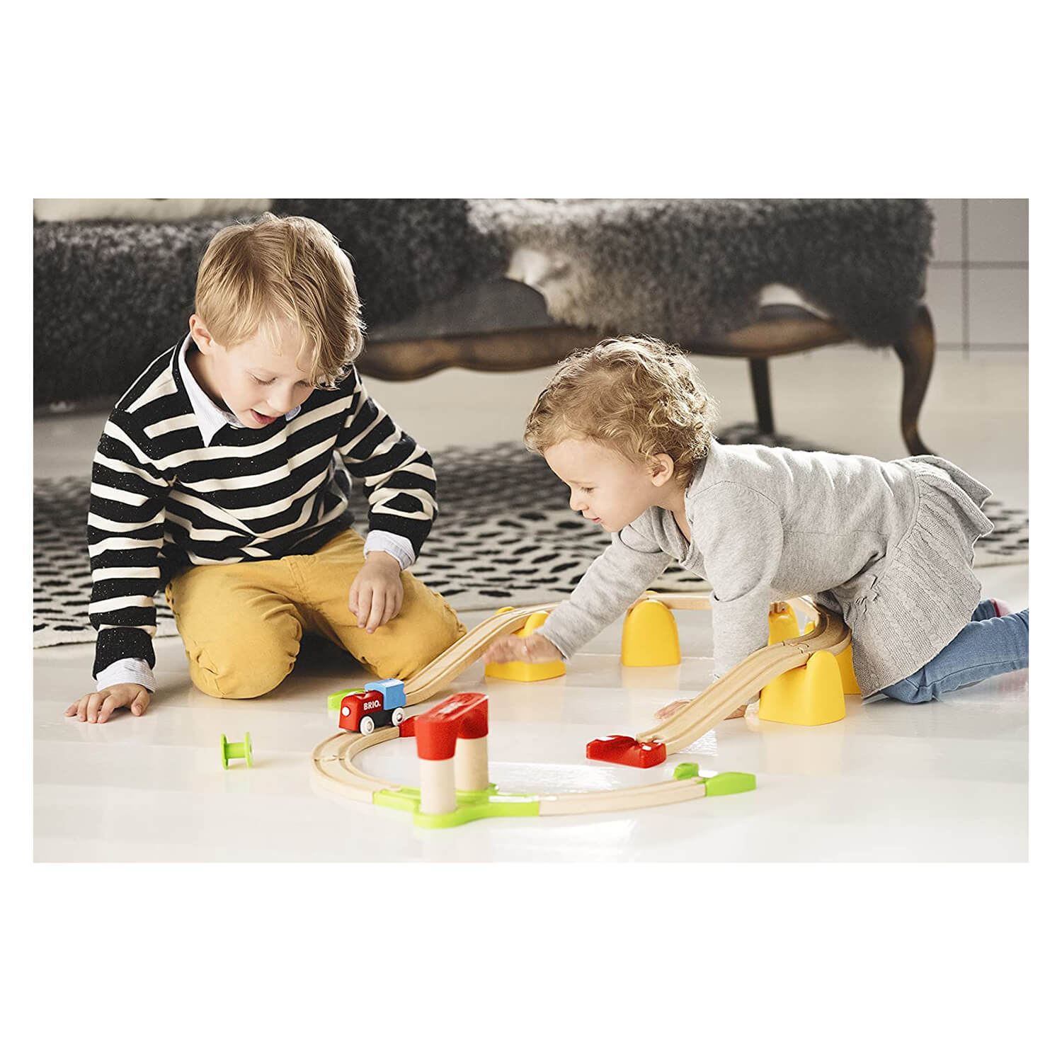 Kids playing with their first train set.