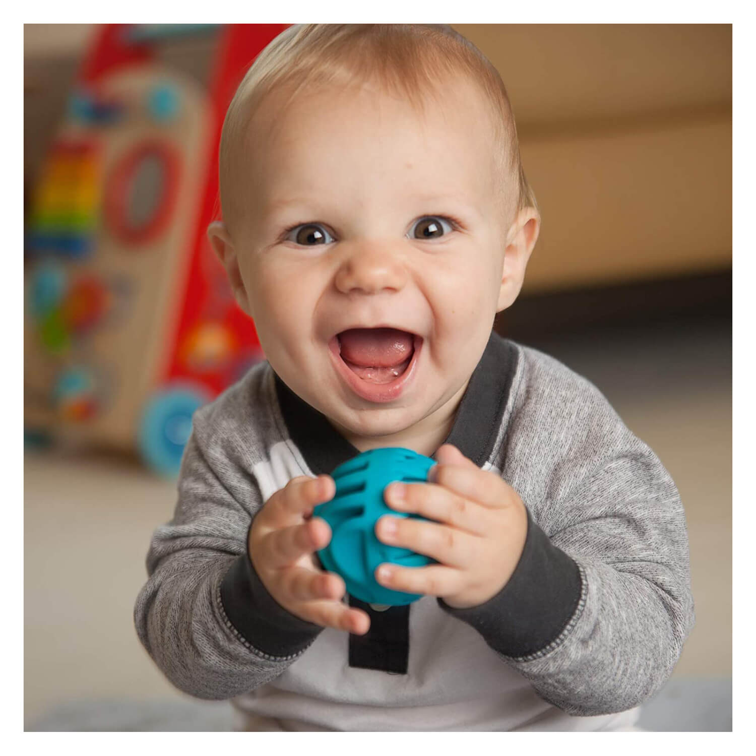 Baby playing with the toy.