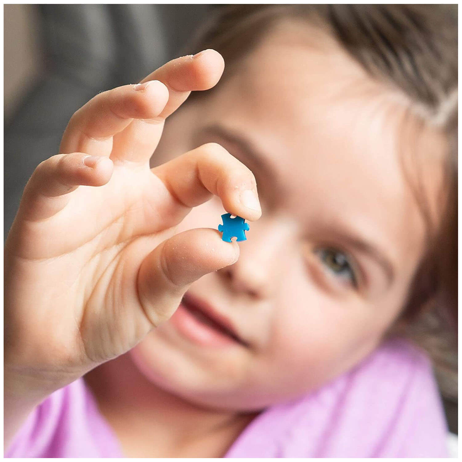 Little girl holding a piece.