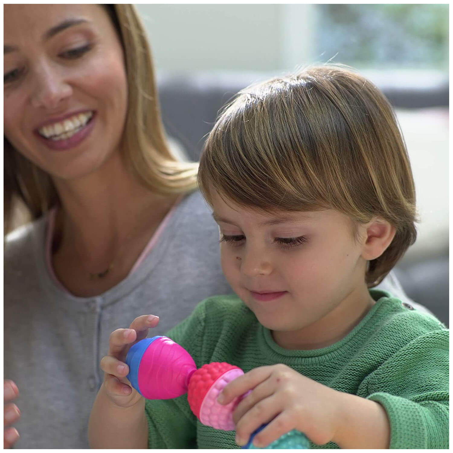 Mother and son playing with the toy.