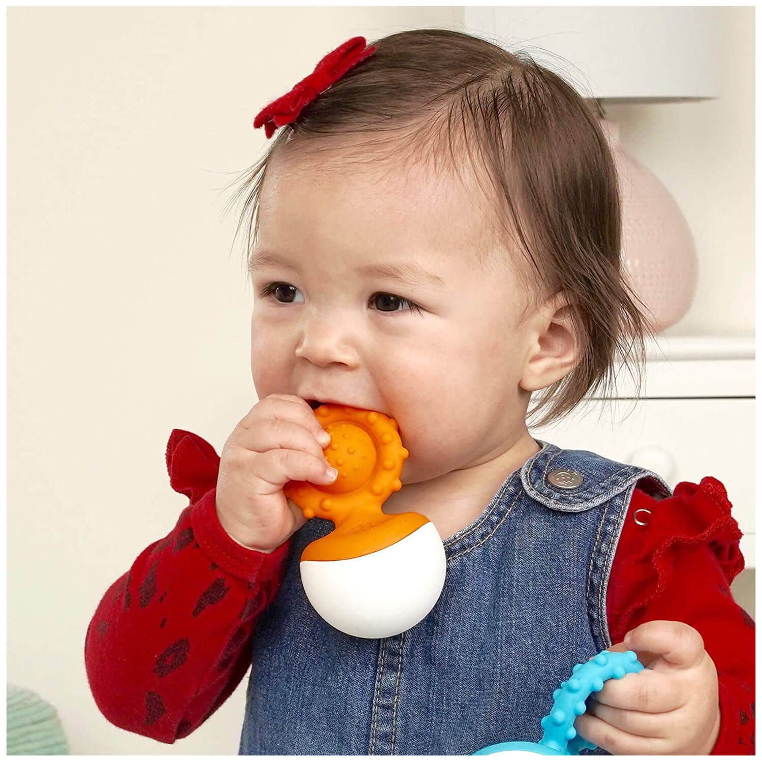 Baby chewing on the toy.