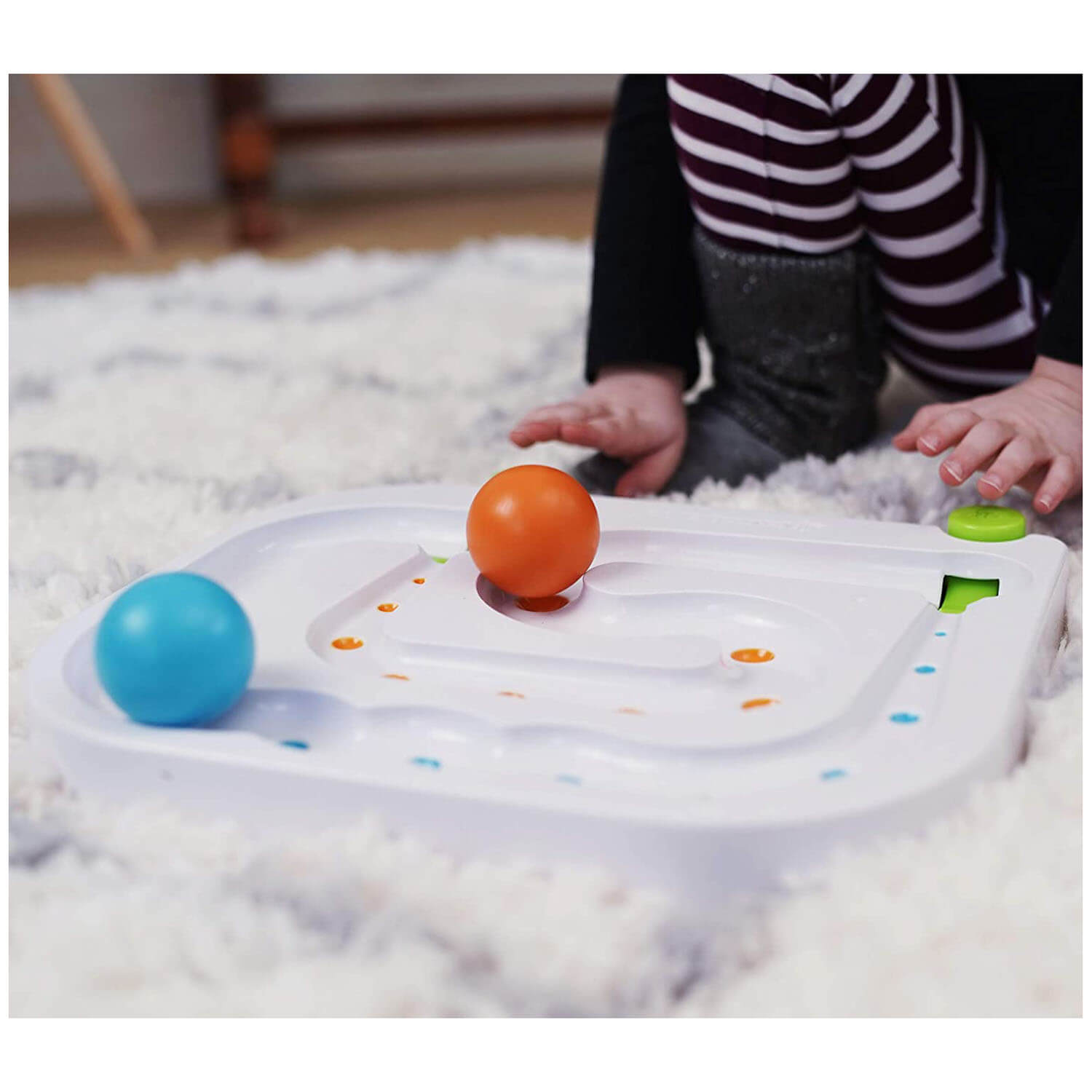 Closeup of child playing with the toy.