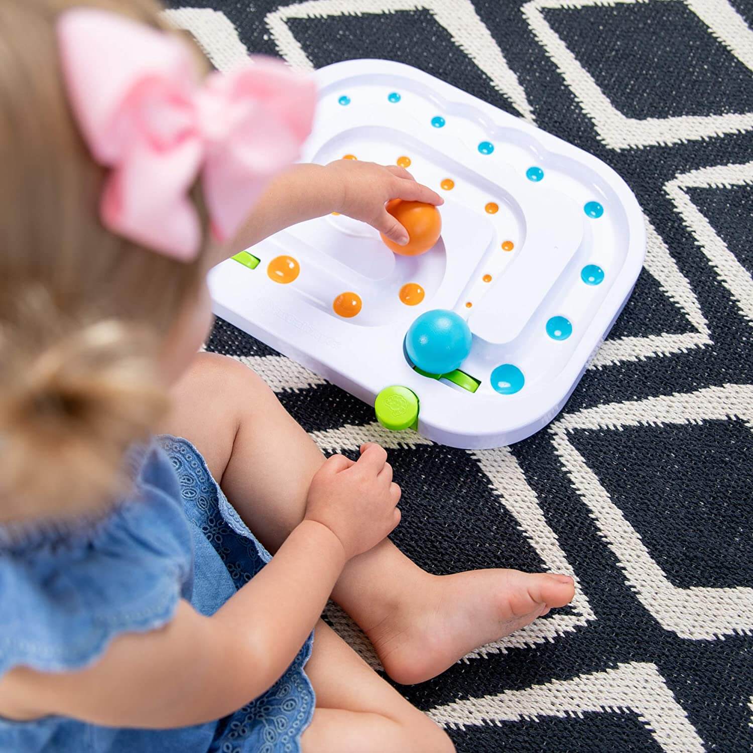 Baby playing with the toy.