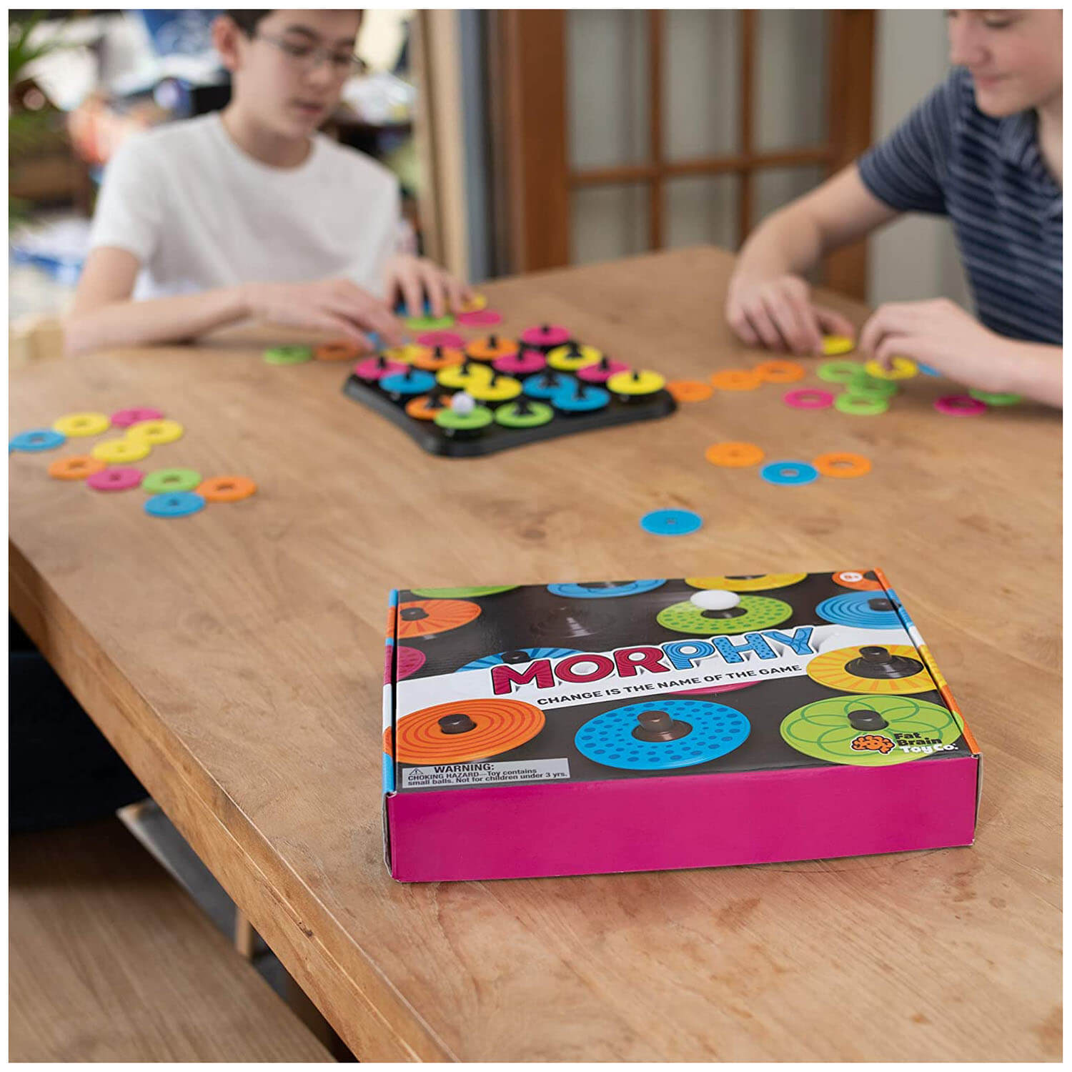 Kids playing the board game.