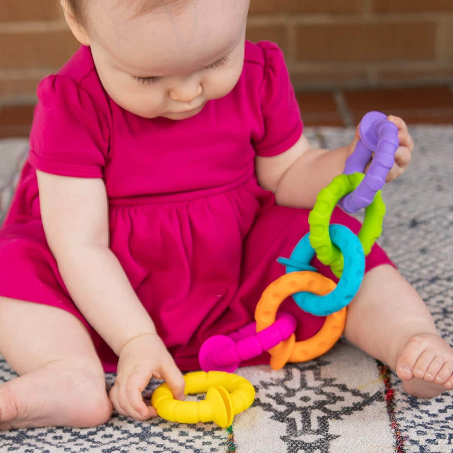 Baby playing with the toy.