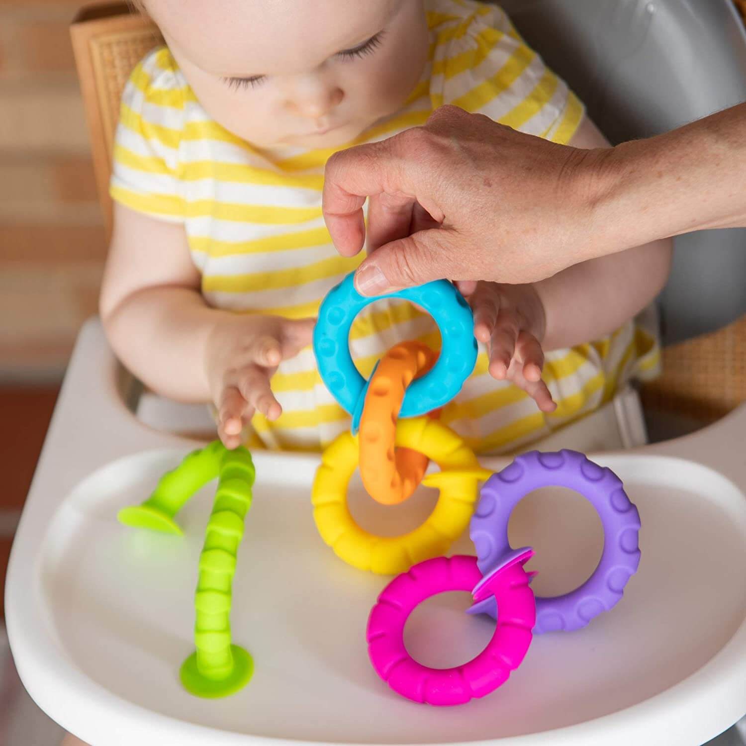 Baby playing with the toy.