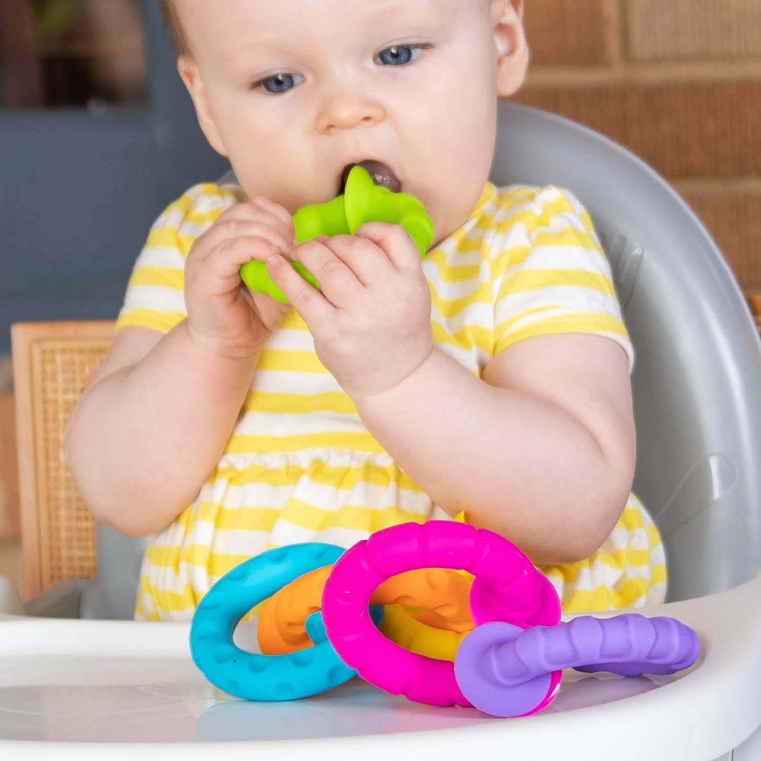 Baby chewing on the toy.