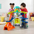 Boy and a girl playing with the Fisher-Price Little People Launch & Loop Raceway