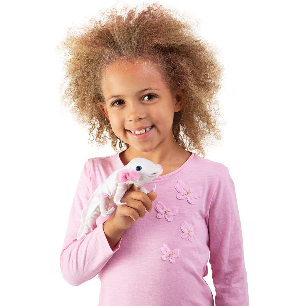 Girl wearing pink is playing with the Folkmanis Axolotl Finger Puppet.