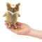 Front view of the Folkmanis Mini Great Horned Owl Finger Puppet, being held by a hand.