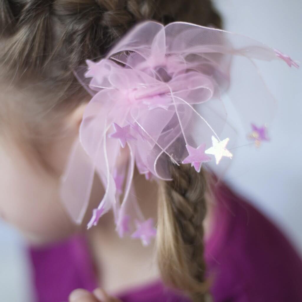 Front view of girl wearing the ponytail holders.