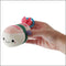 Person holding the Squishables Comfort Food Micro Shrimp Sushi plush keychain.